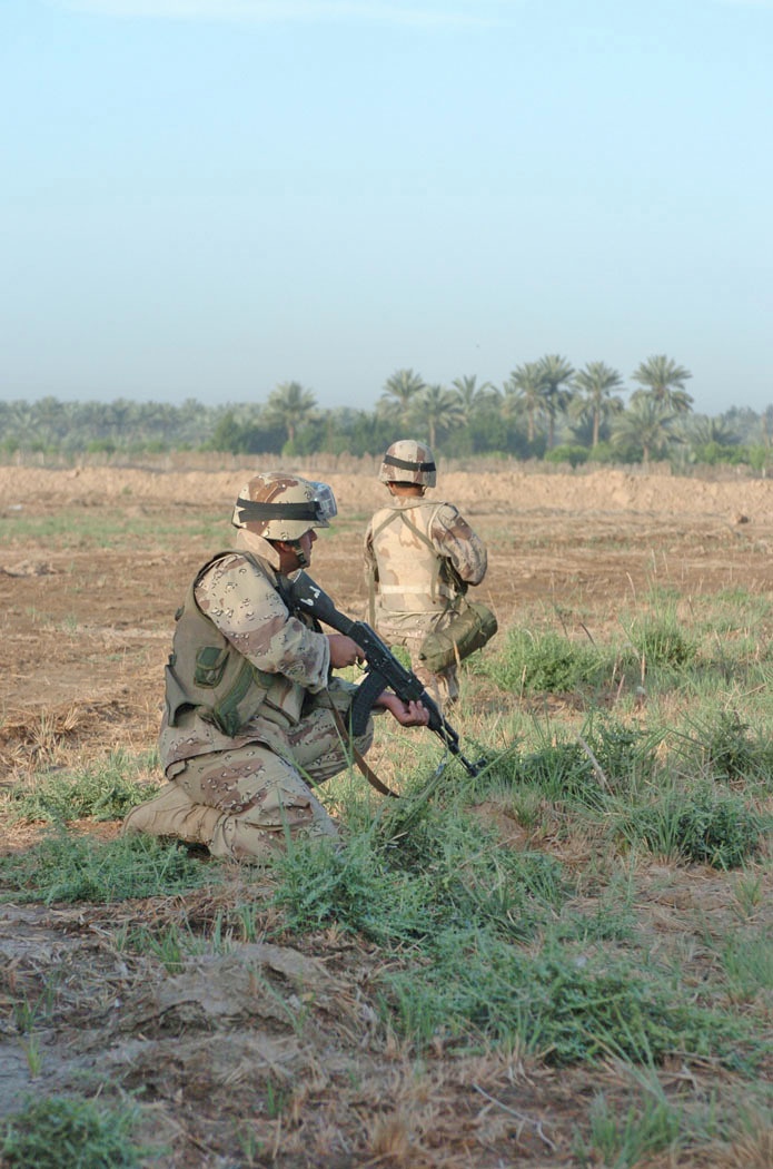 Iraqi Army Soldiers secure an open area north of Salman Pak