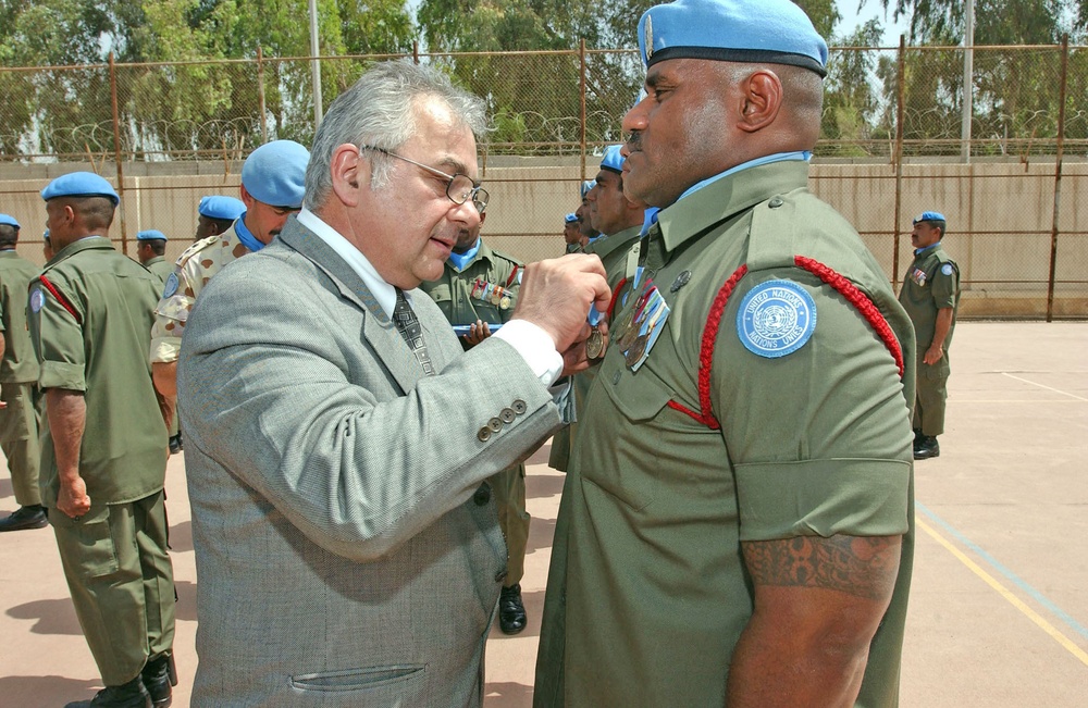 Ashraf Qazi pins on the United Nations Special Service Meda