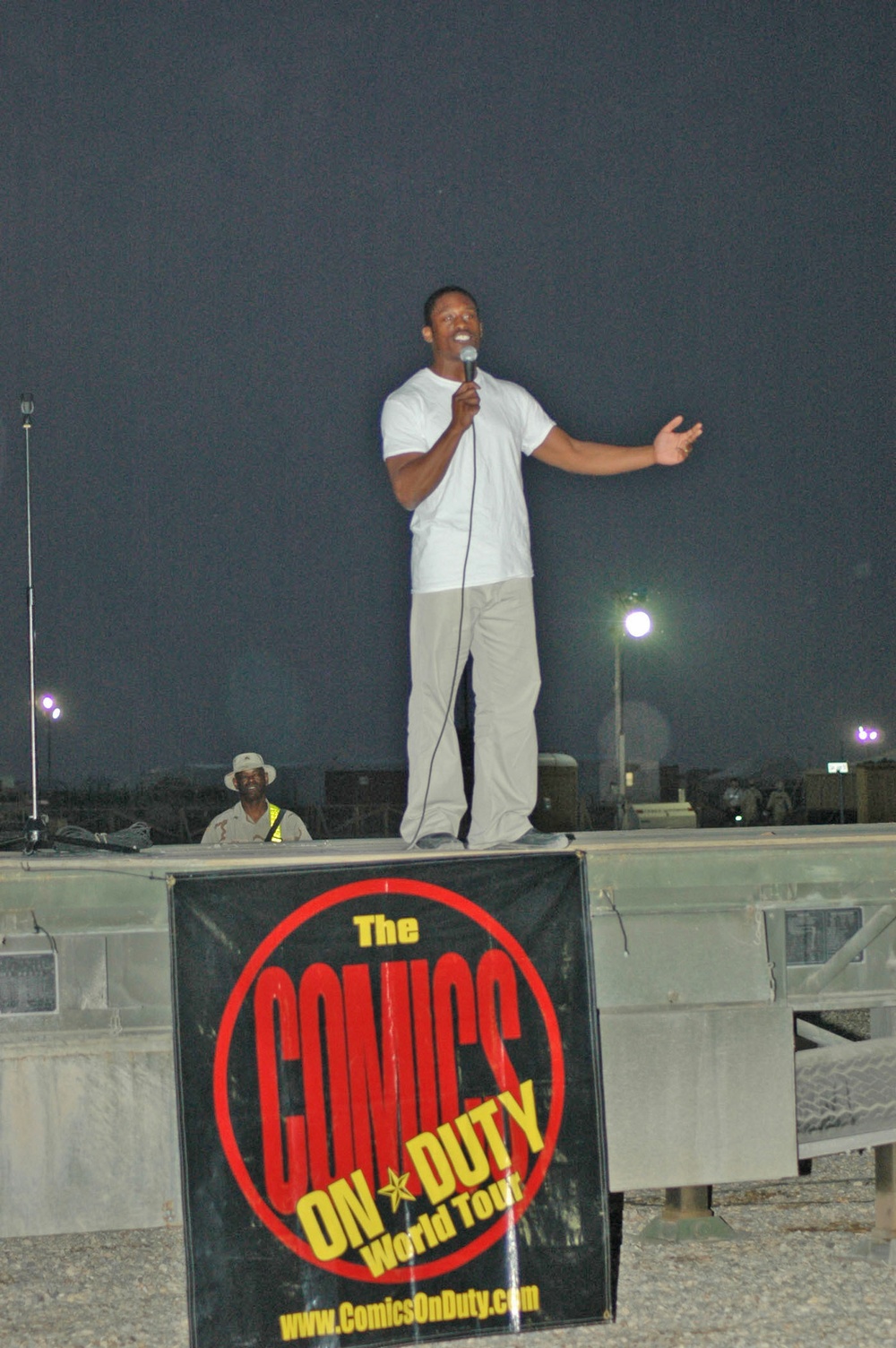 Comics on Duty, entertains a crowd of Soldiers