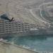 A UH-60 helicopter flies over Haditha Dam