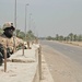 Spc. Jeffrey J. James scans the Baghdad rooftops