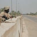 Spc. Jeffrey J. James scans the Baghdad rooftops