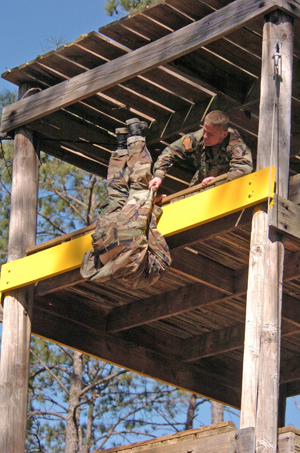 Capt. Wence helps his teammate, Capt. Michael Squires