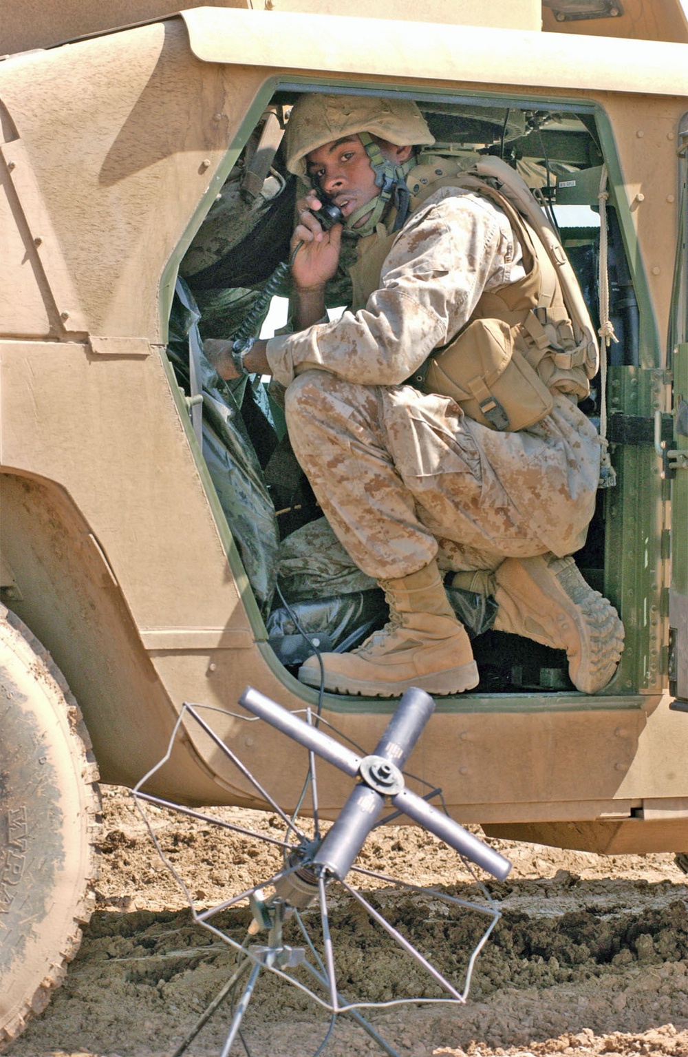 Cpl. Anthony E. Gray sets up a Satellite Radio