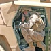 Cpl. Anthony E. Gray sets up a Satellite Radio