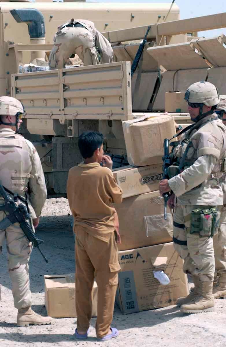 A young Iraqi male chews his finger nails in anticipation