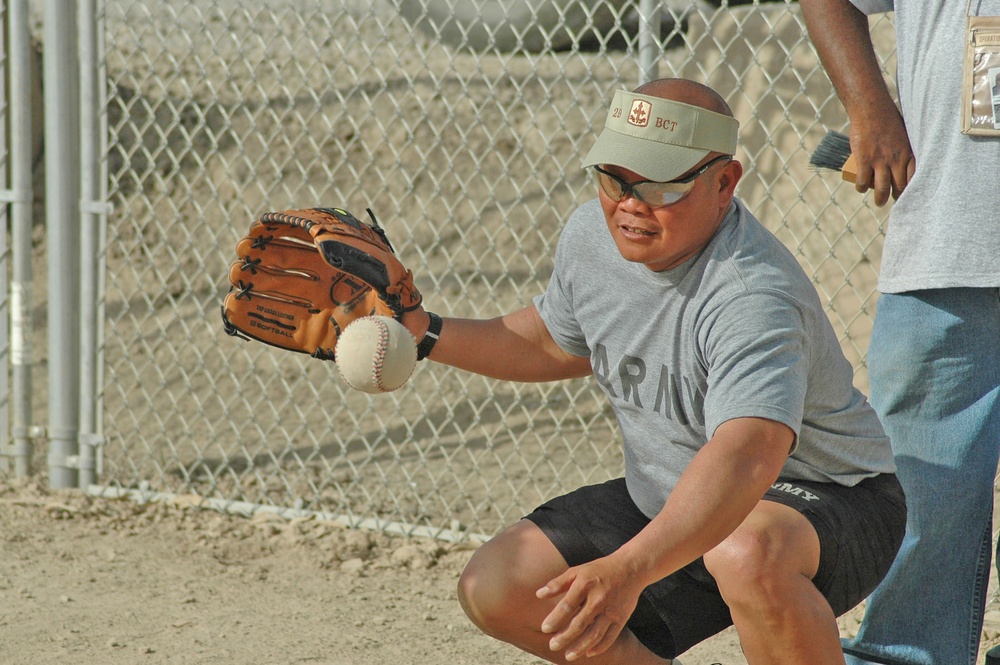 Eddie M. Resinto  prepares to catch the ball behind homeplate