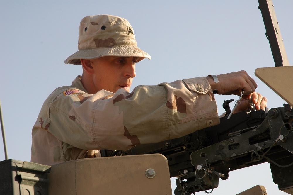 Sgt. Brian Jones checks a .50-calibur machine gun