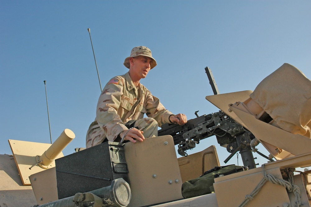 Sgt. Brian Jones checks a .50-calibur machine gun