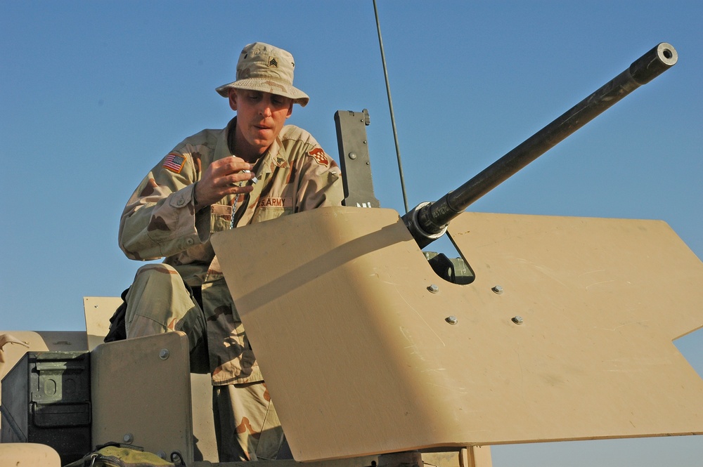 Sgt. Brian Jones checks a .50-calibur machine gun