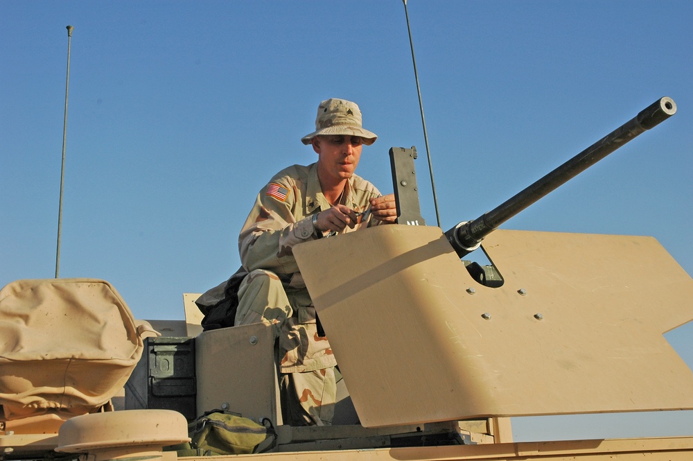 Sgt. Brian Jones checks a .50-calibur machine gun