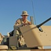 Sgt. Brian Jones checks a .50-calibur machine gun