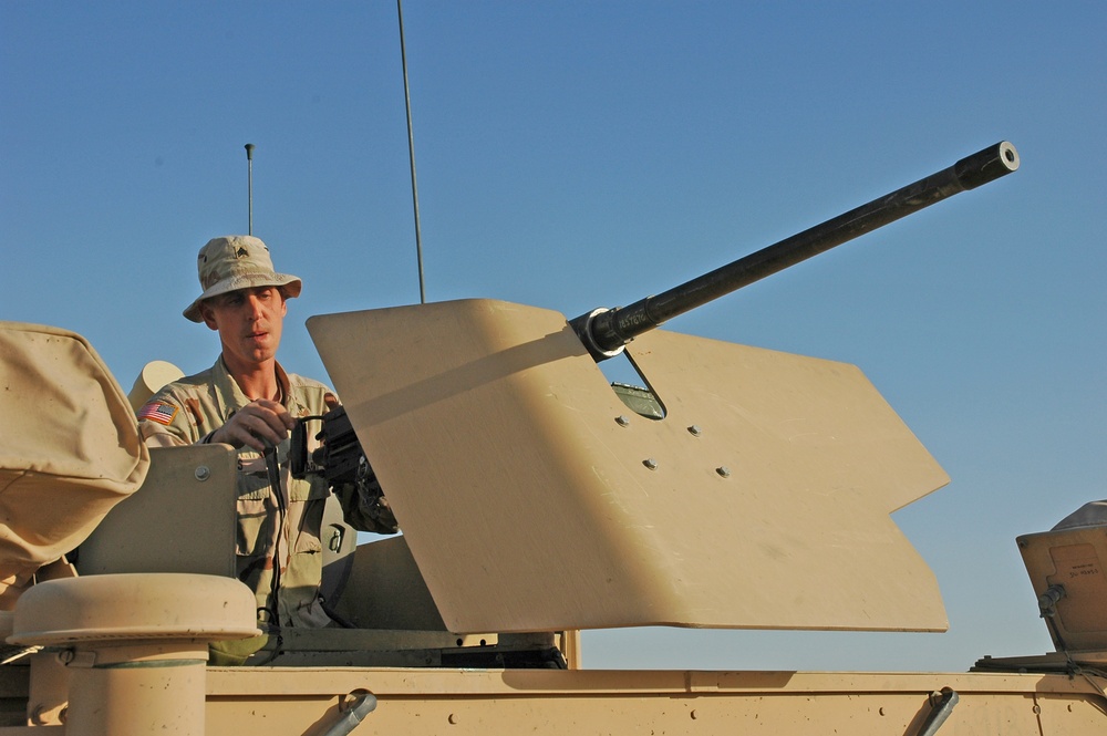 Sgt. Brian Jones checks a .50-calibur machine gun