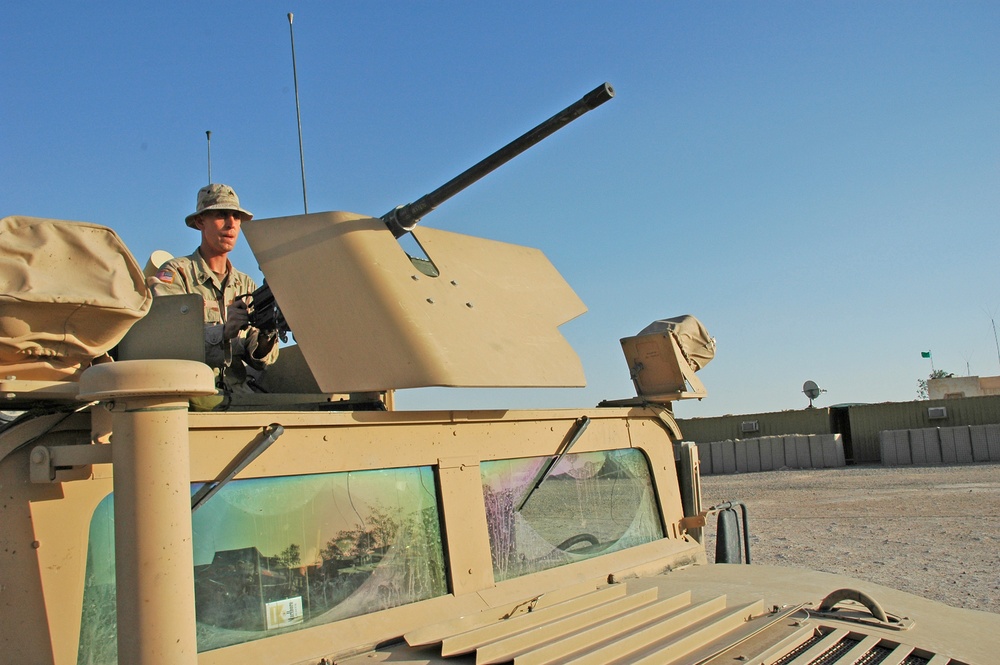 Sgt. Brian Jones checks a .50-calibur machine gun