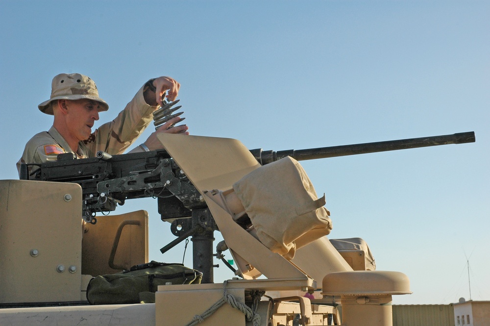 Sgt. Brian Jones checks a .50-calibur machine gun