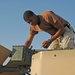 Spc. Jay Groover prepares the .50-calibur machine gun