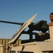 Spc. Jay Groover checks a .50-calibur machine gun