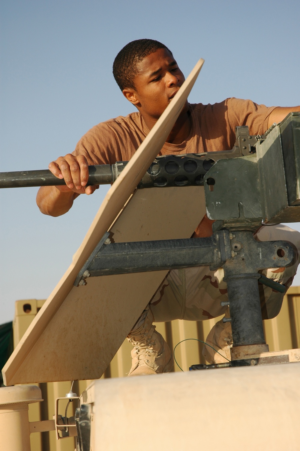 Spc. Jay Groover checks a .50-calibur machine gun