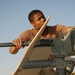 Spc. Jay Groover checks a .50-calibur machine gun