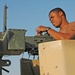 Spc. Jay Groover checks a .50-calibur machine gun