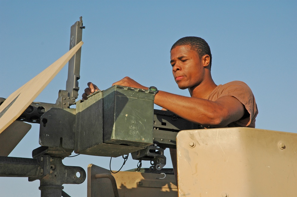 Spc. Jay Groover checks a .50-calibur machine gun