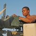 Spc. Jay Groover checks a .50-calibur machine gun