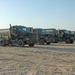 Drivers convoy tankers of fuel between Camps Taqqadum