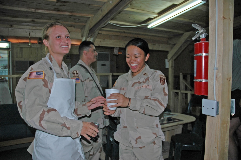 Spc. Emily Wiest delivers the first-ever cup of iced coffee