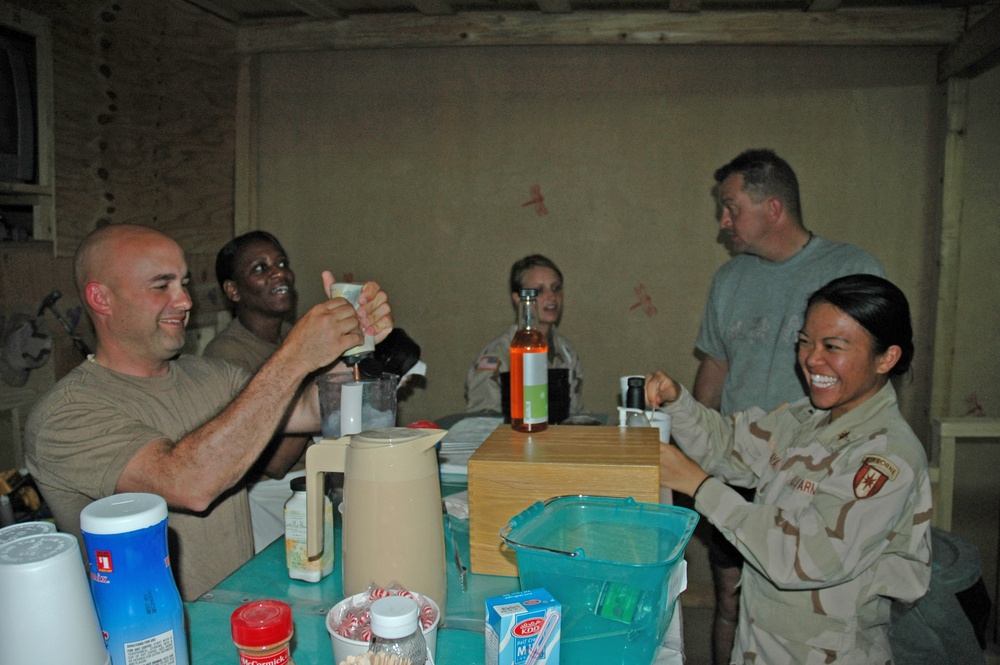 Soldiers crowd around the counter of the Coffee House