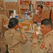 Soldiers try the first batch of iced coffee made