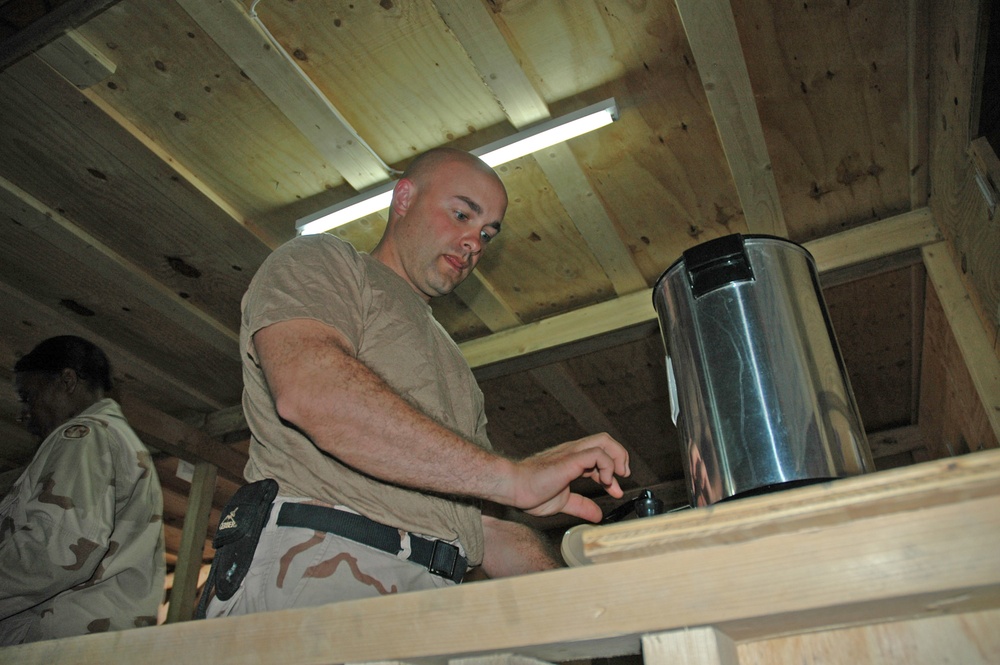 Sgt. 1st Class Rick Weiss pours a cup of coffee