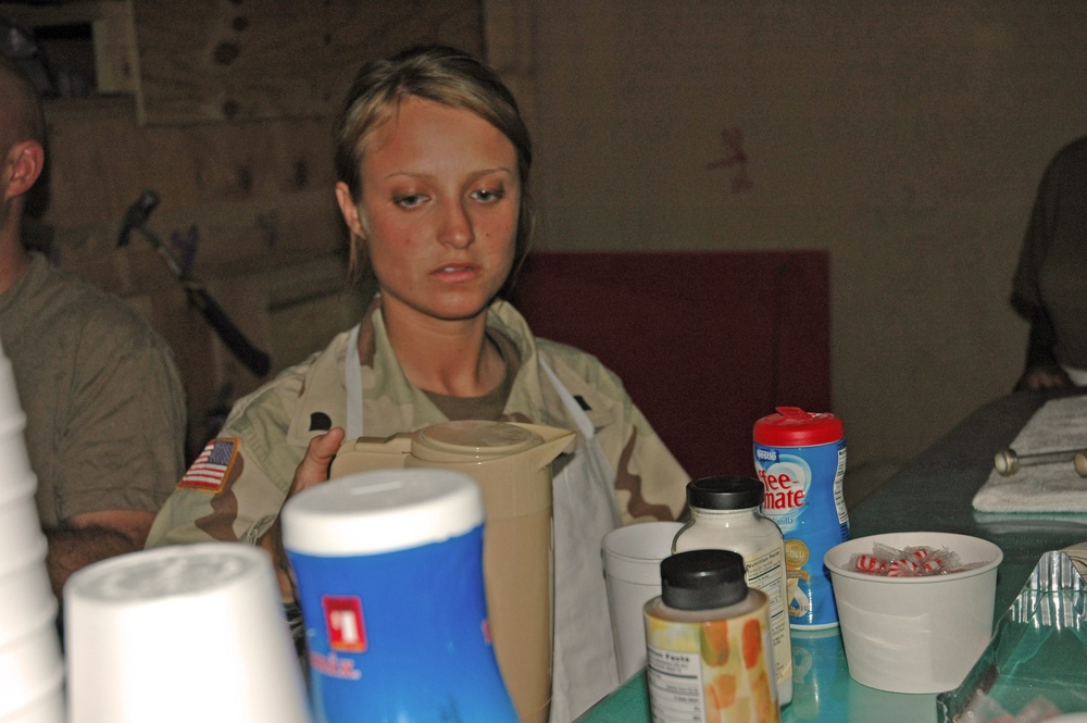 Spc. Emily Wiest pours a cup of coffee for a customer