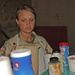 Spc. Emily Wiest pours a cup of coffee for a customer