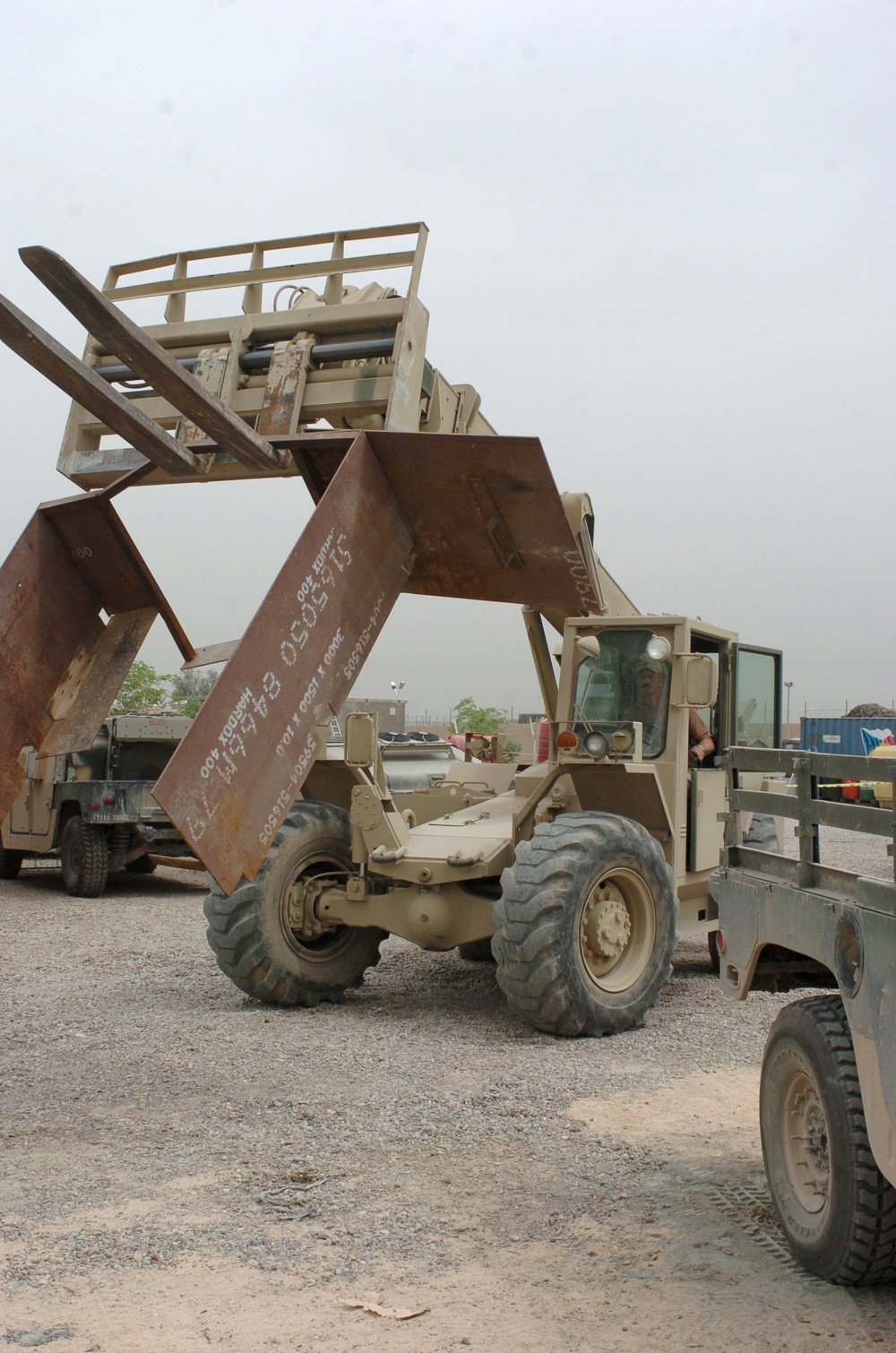 Sgt. Ronald Todd Gates operates a forklift