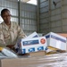 Sgt. Rita Parker sorts through and organizes mail