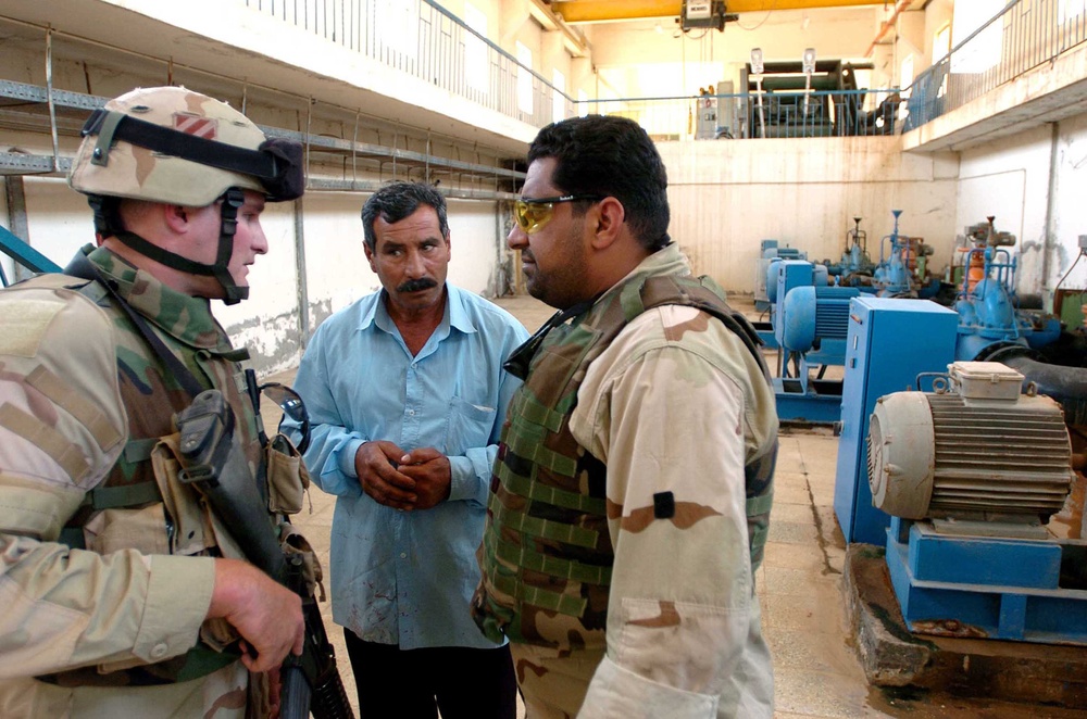 Capt. James Hock speaks with an operator of the facility