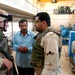 Capt. James Hock speaks with an operator of the facility