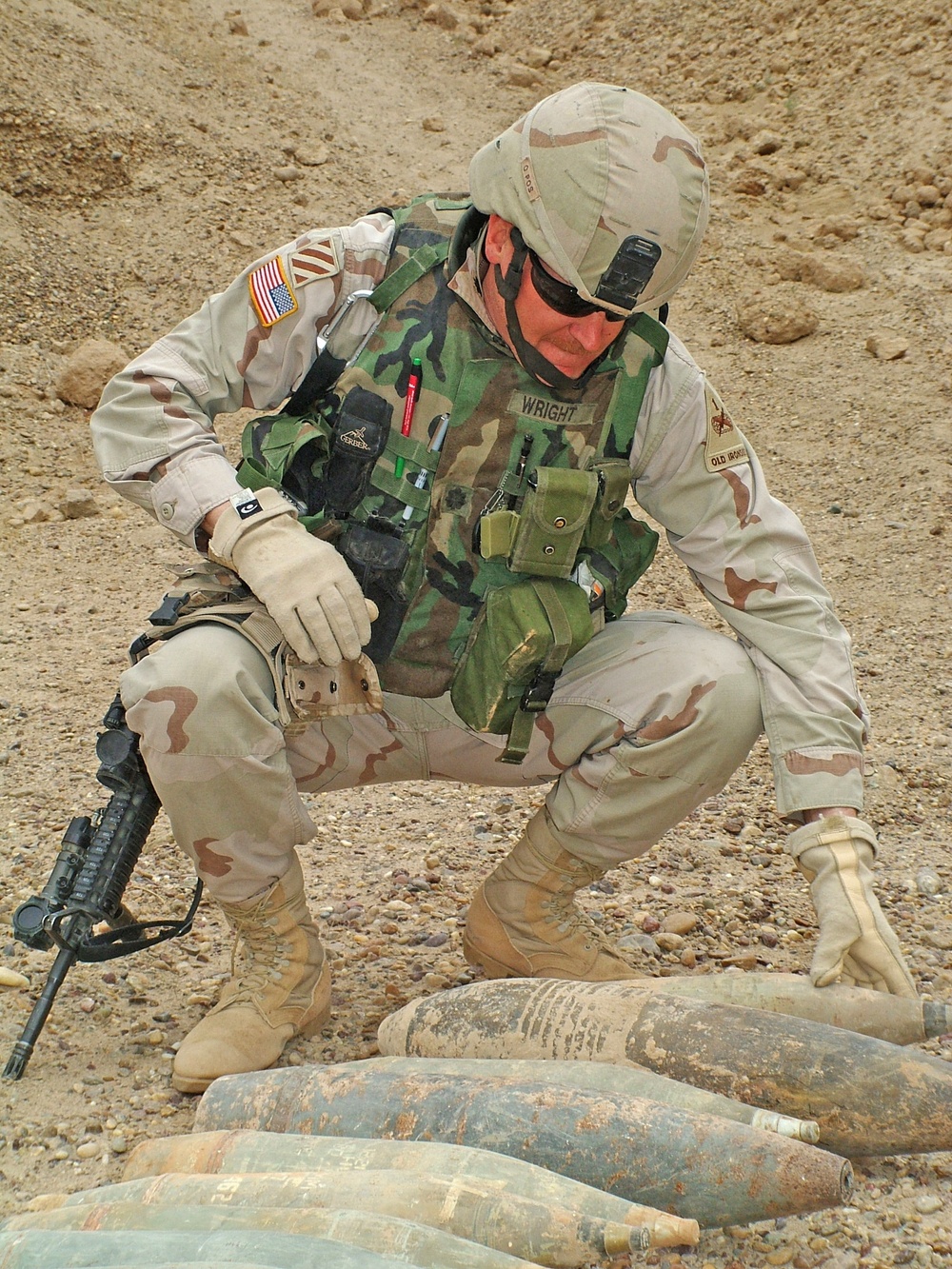 Lt. Col. Wright examines some of the heavy munitions unearthed