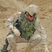 Lt. Col. Wright examines some of the heavy munitions unearthed