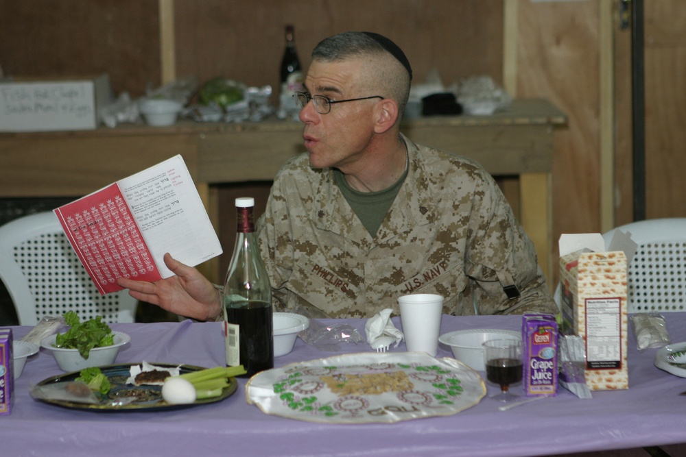 Lt Commander Phillips reads from the Haggadah