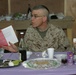 Lt Commander Phillips reads from the Haggadah