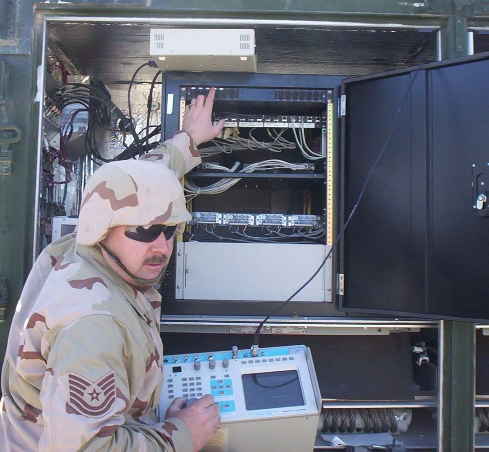 Tech. Sgt. Hank ONeill runs tests on the radio equipment