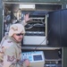 Tech. Sgt. Hank ONeill runs tests on the radio equipment