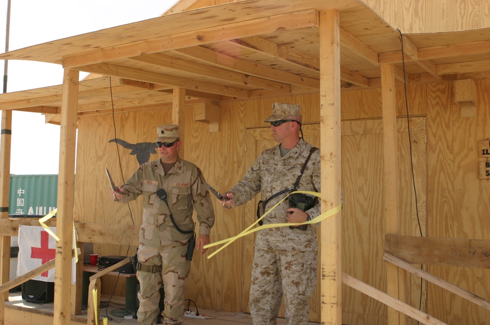 Lt. Col. Hall and Col. Wissler cut the ribbon