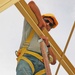 Construction employees work on the structure