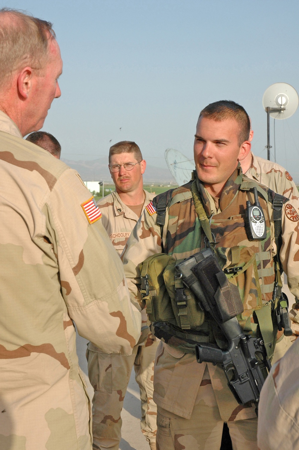 Spc. John D. Henington receives a division coin