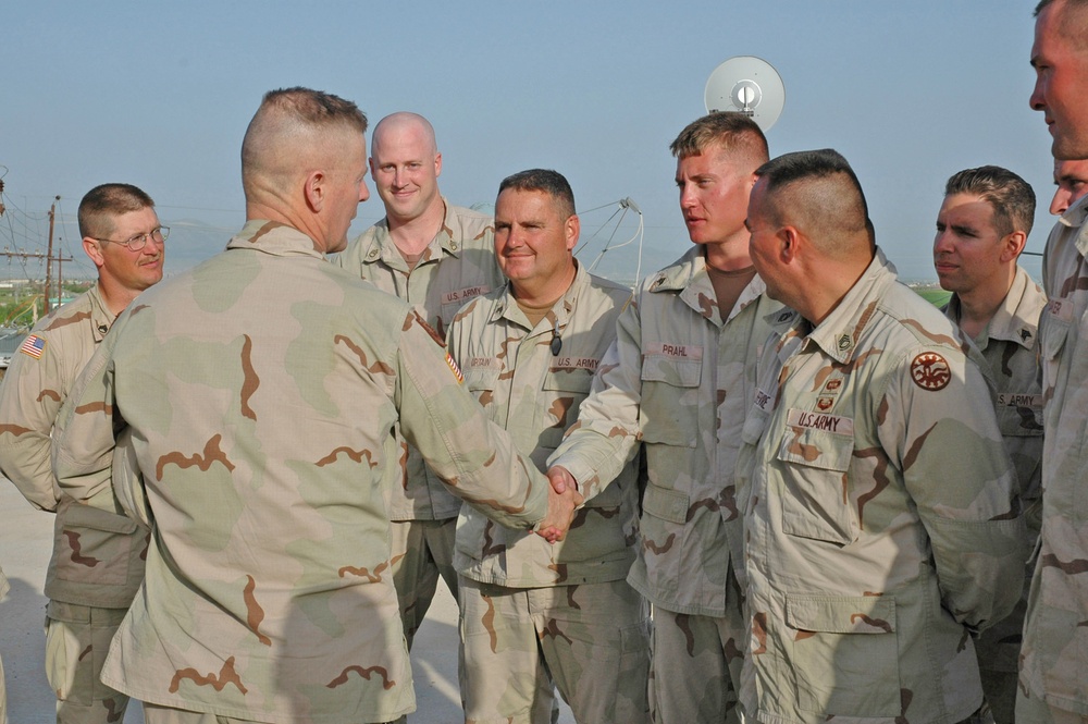 Sgt. Zachary Prahl shakes the hand of Sgt. Maj. Mellinger