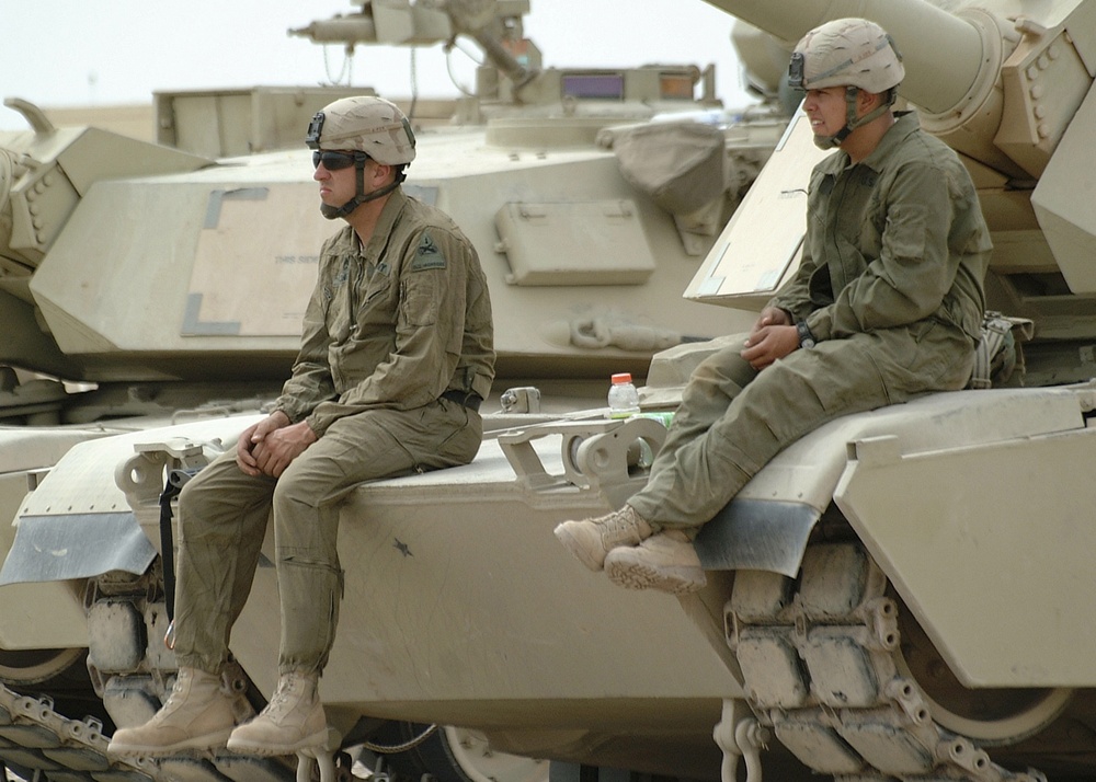 SFC Konken and Spc. Leija watch their fellow tankers