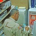 Spc. Turner inventories medicene at the troop medical clinic