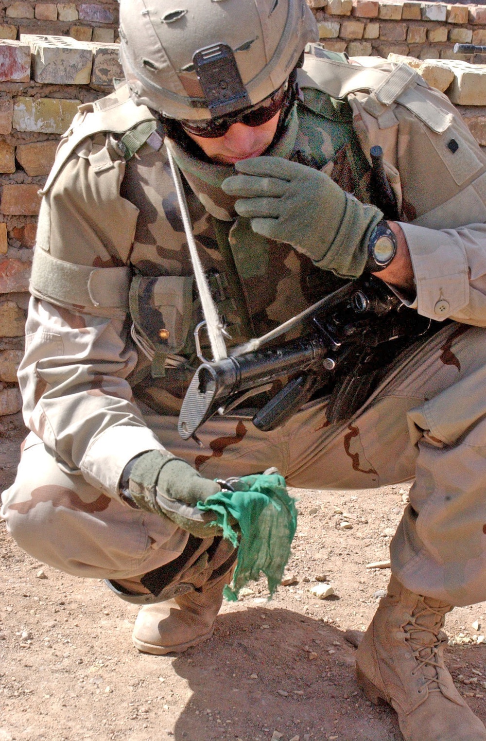 Staff Sgt. Russell Odonnell inspects a bag of coins